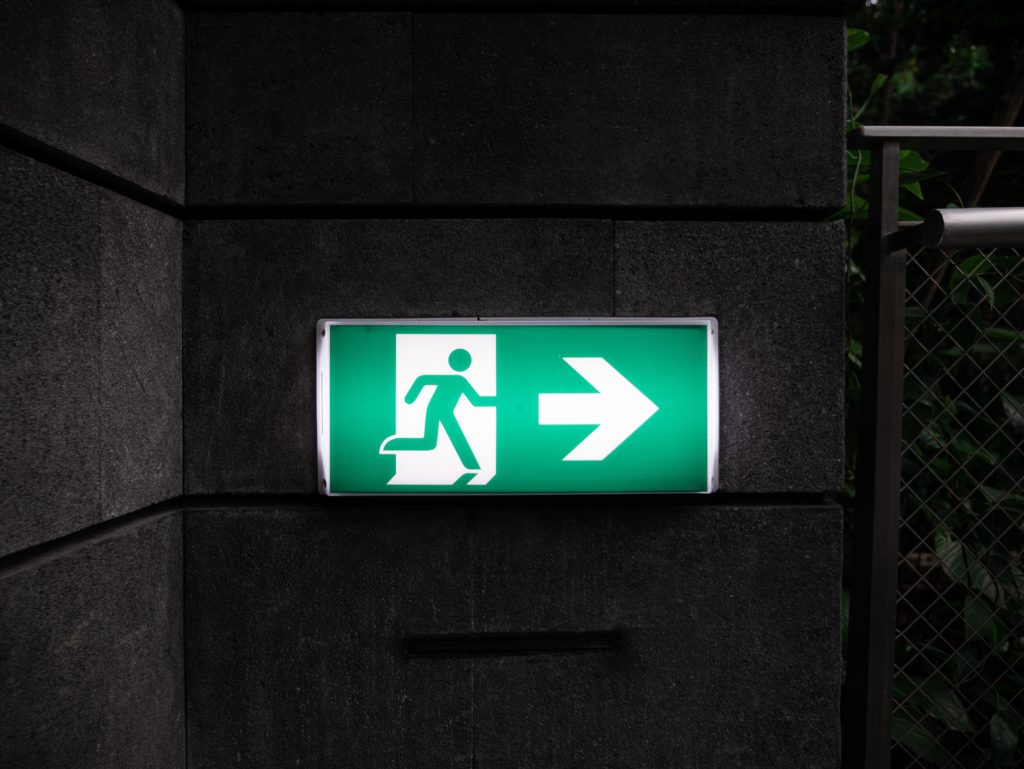 exit sign indicating gross misconduct dismissal