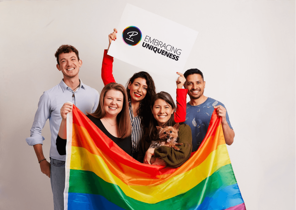 Group of young people holding pride flag